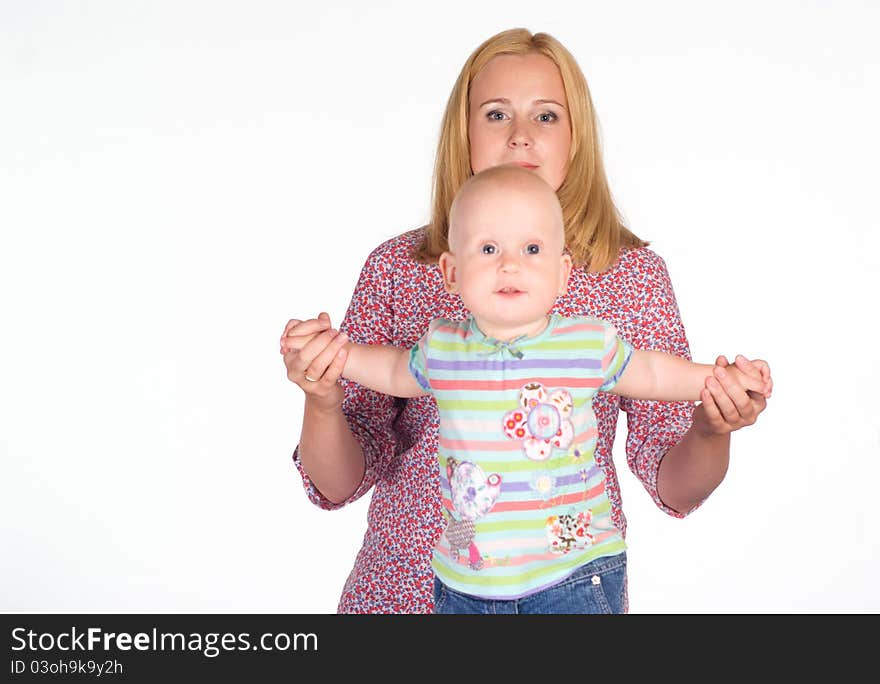 Cute mom holding her baby on whie. Cute mom holding her baby on whie