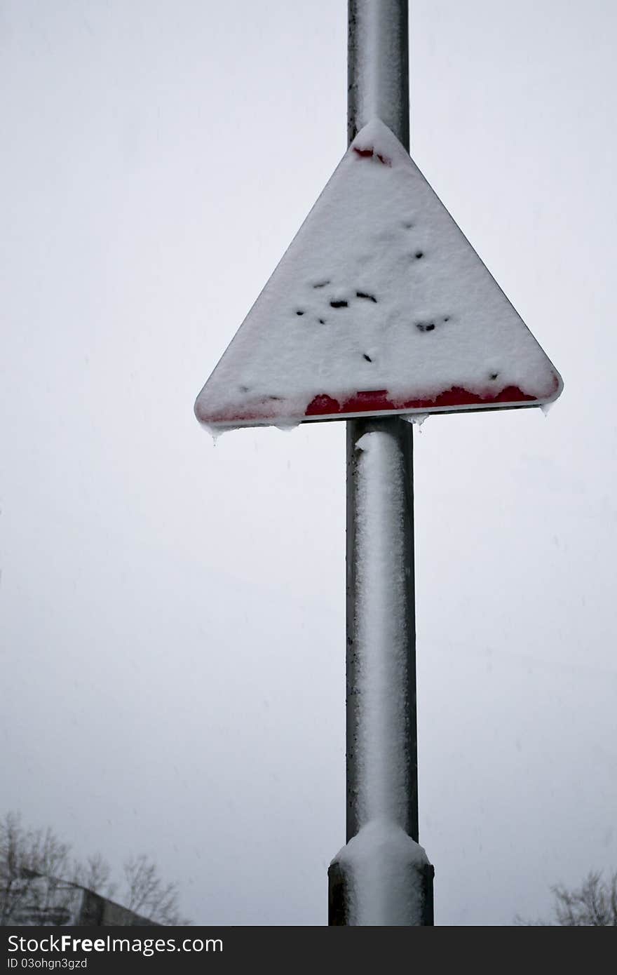 Snow-covered road sign after blizzard. Snow-covered road sign after blizzard