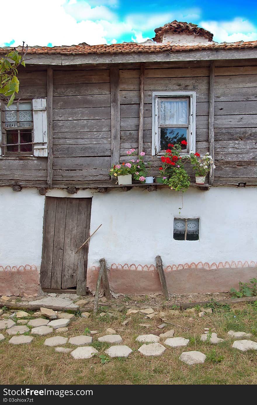 Old house of mud and wood decorated with flowers. Old house of mud and wood decorated with flowers