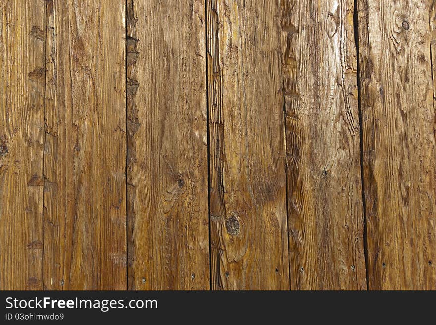 The texture of old scratched wooden planks. The texture of old scratched wooden planks