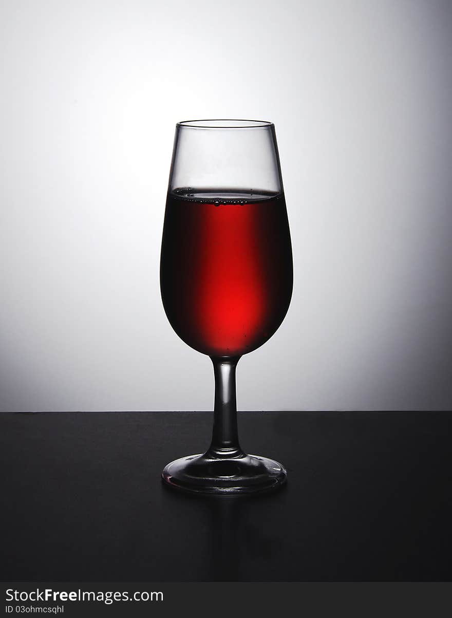 A glass of red wine ready to drink. A glass of red wine ready to drink