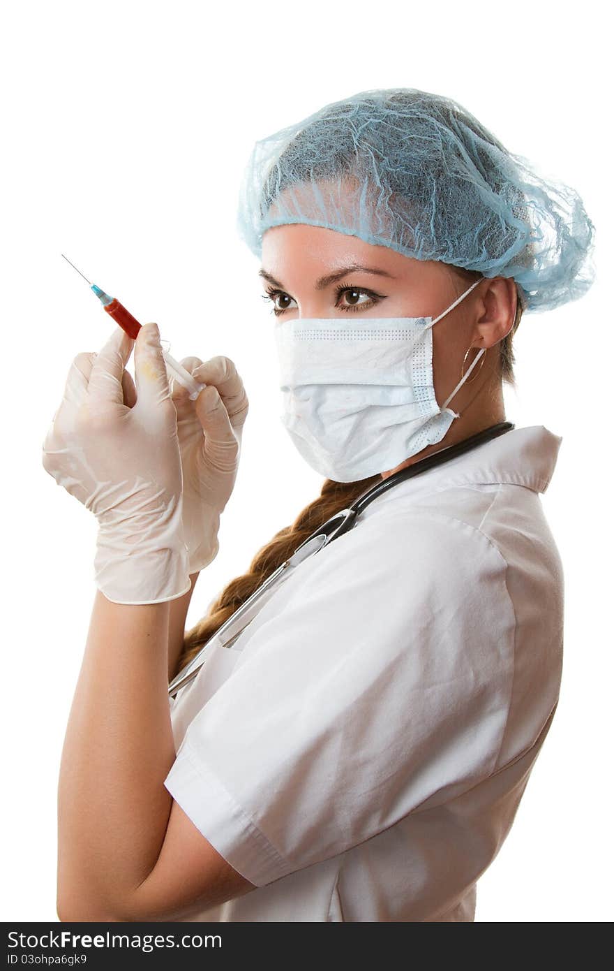 Beautiful doctor in a medical mask, sterile gloves on the isolated white background. Beautiful doctor in a medical mask, sterile gloves on the isolated white background