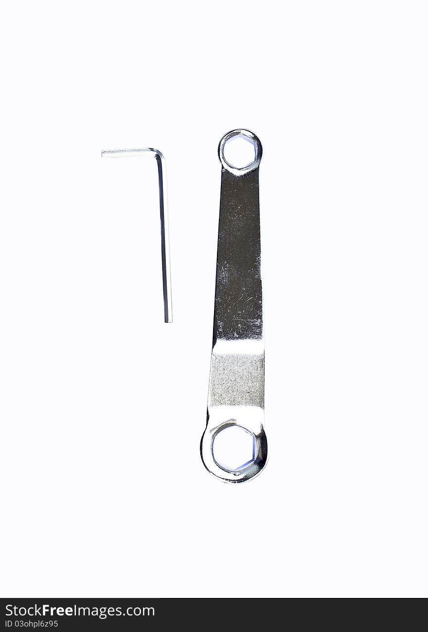 Hex key and ring spanner wrench on a white background. Hex key and ring spanner wrench on a white background