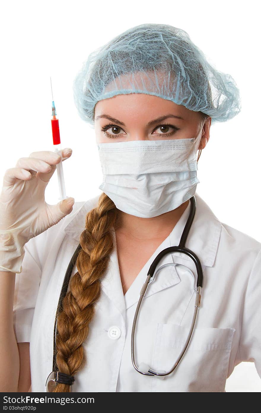 doctor in a medical mask, gloves and injection