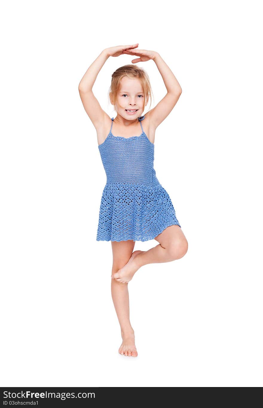 Funny pretty little girl in blue dress isolated on white background.