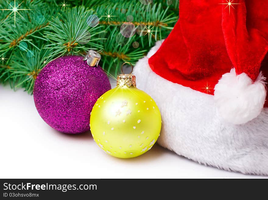 Fir-tree with toy and cap on white background. Fir-tree with toy and cap on white background