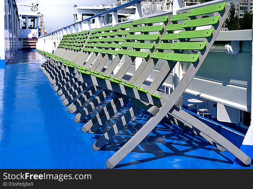 Row of chairs on the deck of the ship