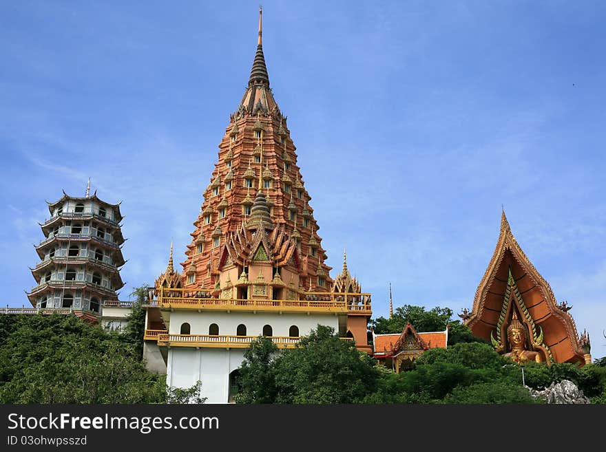 Beautiful Thai temple which has wonderful scuba and big Buddha monument is located on the hill with nice sky. Beautiful Thai temple which has wonderful scuba and big Buddha monument is located on the hill with nice sky