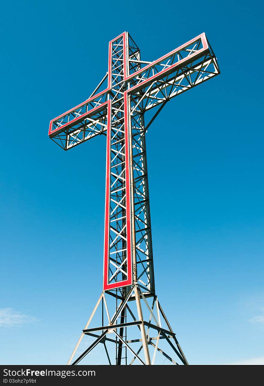 Holy cross monument at the top of a hill