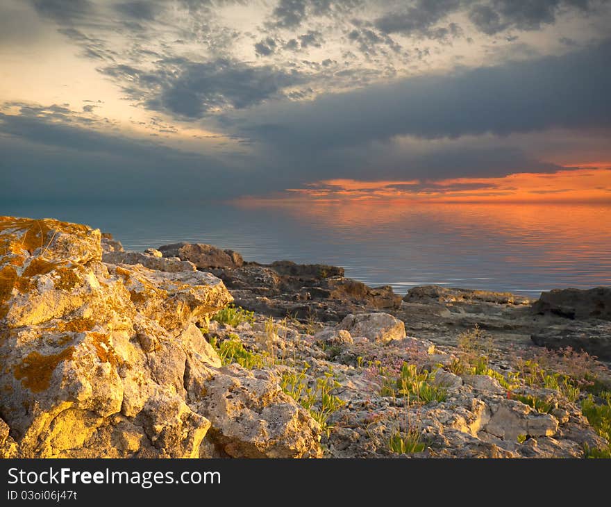 Sea and rock at the sunset