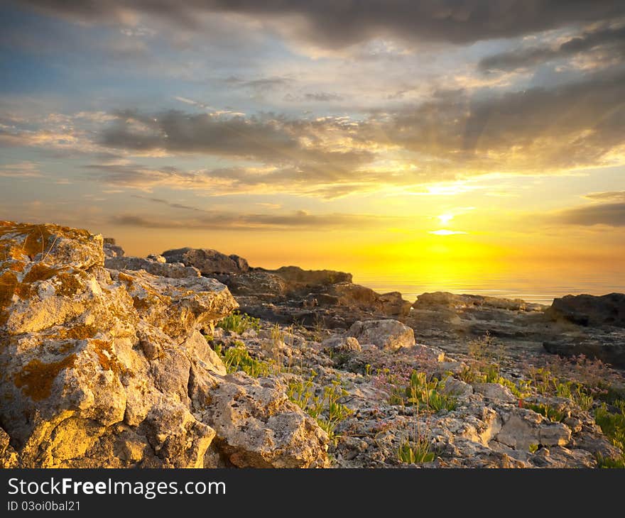 Sea and rock at the sunset