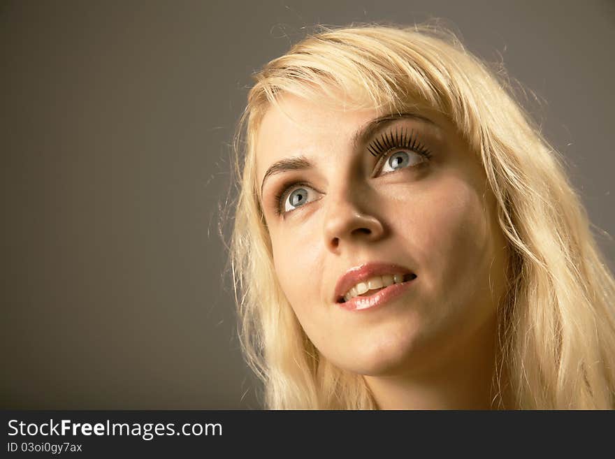 Portrait of woman thinking and looking up. Portrait of woman thinking and looking up