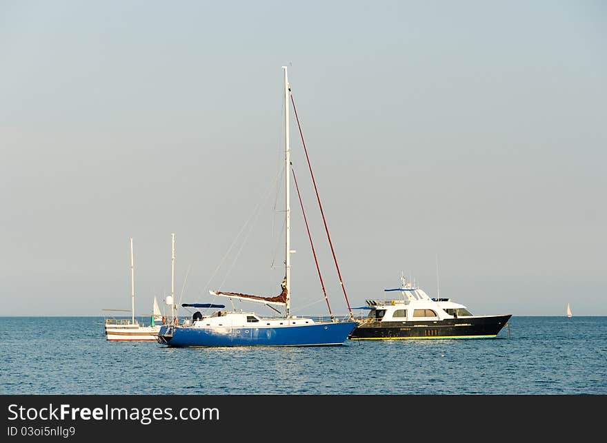 Three yachts in harbour. Summer. Black sea.