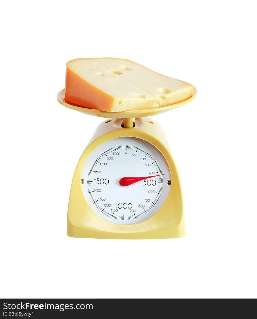 Piece of cheese lying on nice yellow kitchen scale. Isolated on white with clipping path. Piece of cheese lying on nice yellow kitchen scale. Isolated on white with clipping path