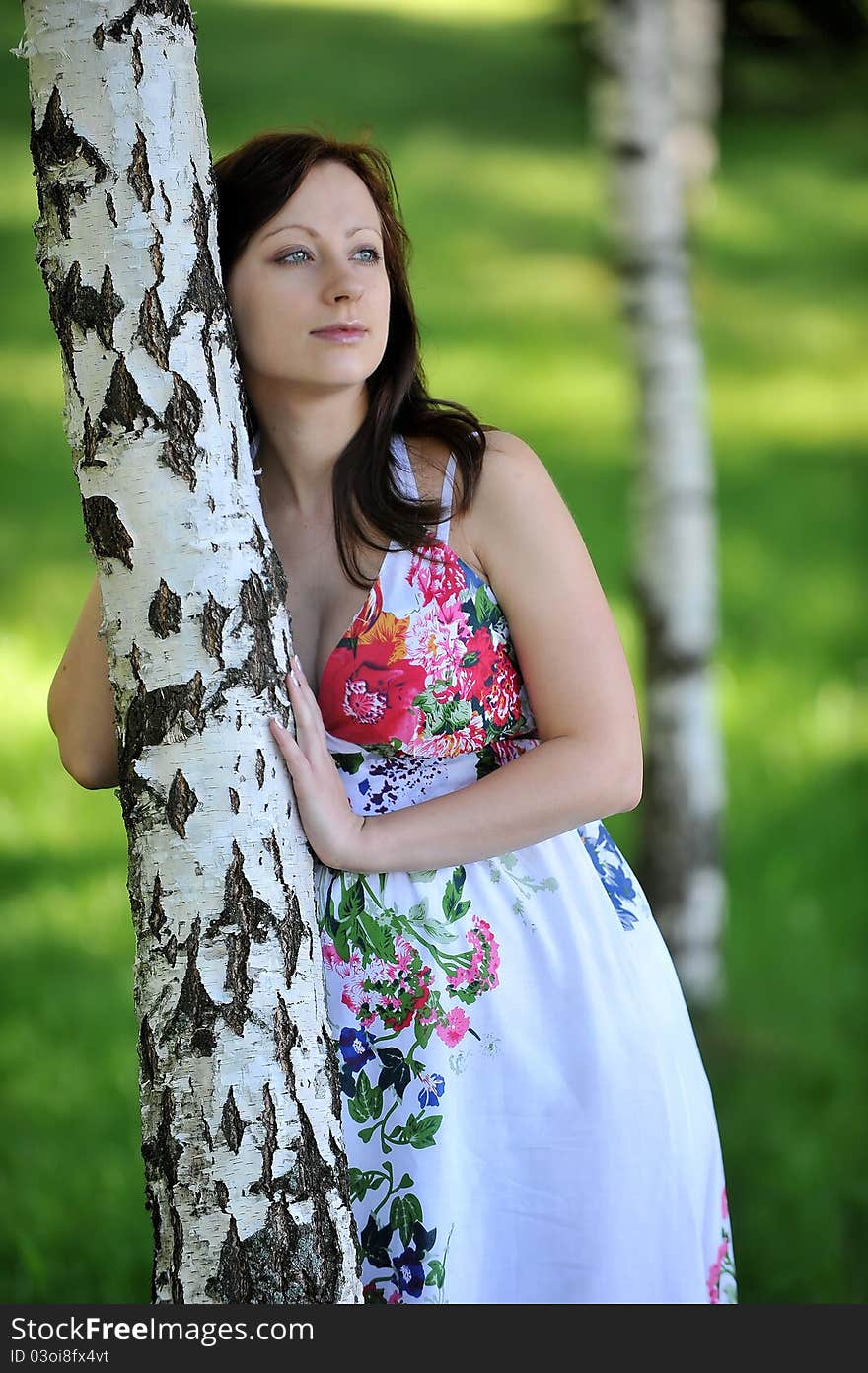 Beautiful future mom standing near tree. summer's day. Beautiful future mom standing near tree. summer's day.