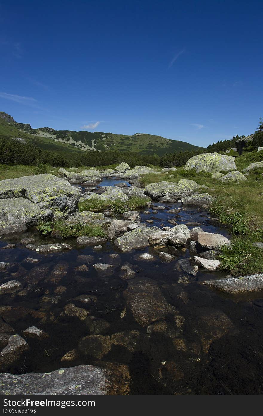 Tatra mountains and small river between. Tatra mountains and small river between.