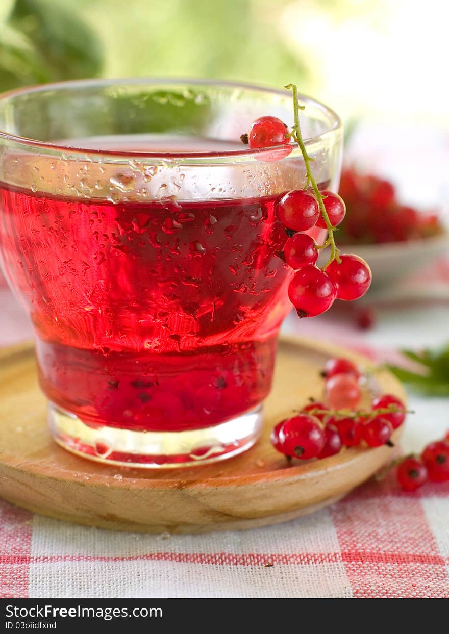 Cold drink with red currant. Selective focus