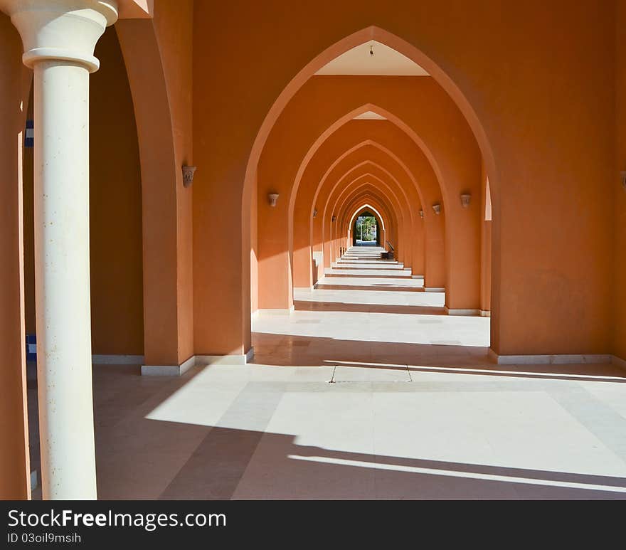 Corridor of arches in a building going into the distance. Corridor of arches in a building going into the distance