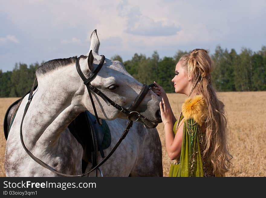 Horse and beautiful woman face to face. Horse and beautiful woman face to face