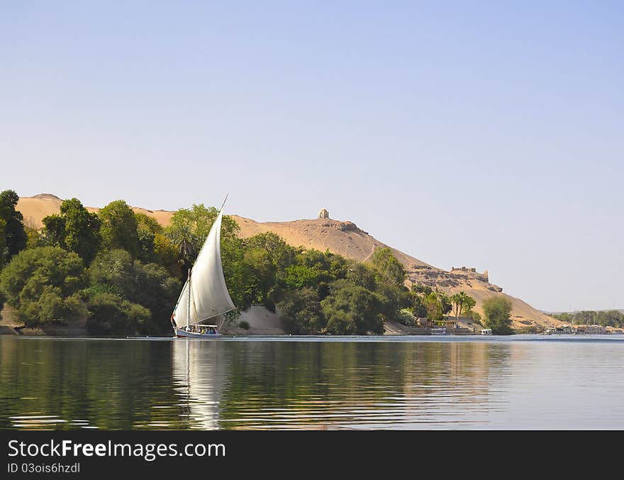 View Of The Nile With A Traditional Felluca Boat