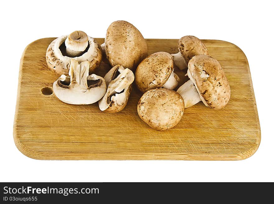 Peanut mushrooms on little plank.