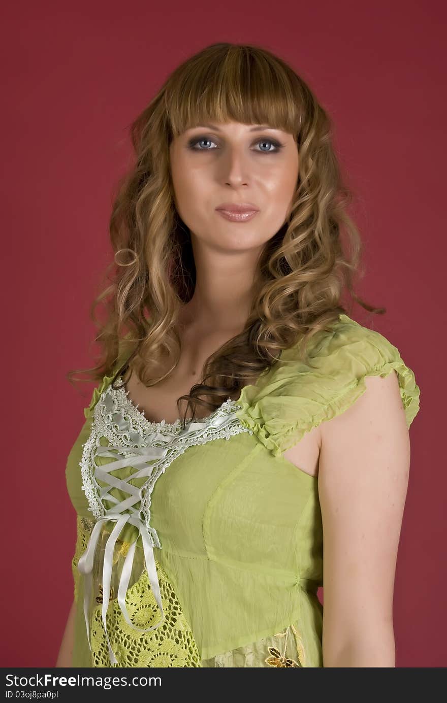 Sexy Girl In A Green Dress Looks At You