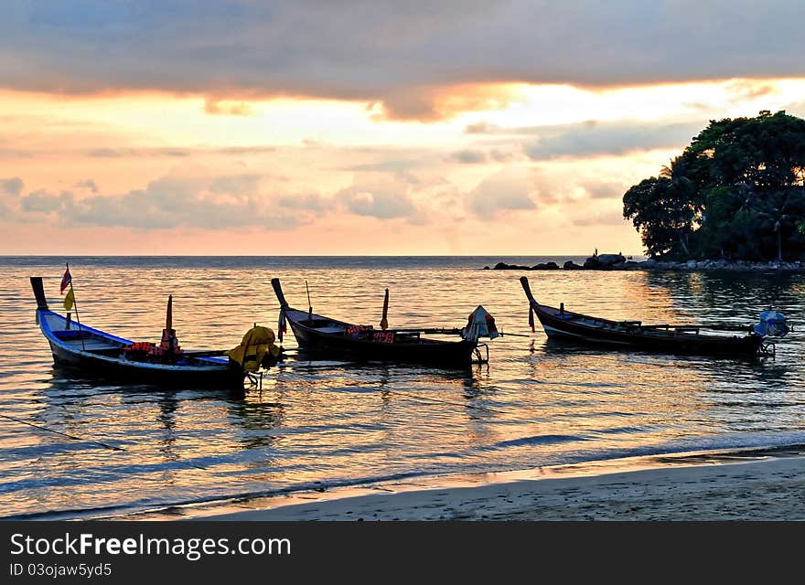 Three longtail boats near the beach in sunset. Three longtail boats near the beach in sunset