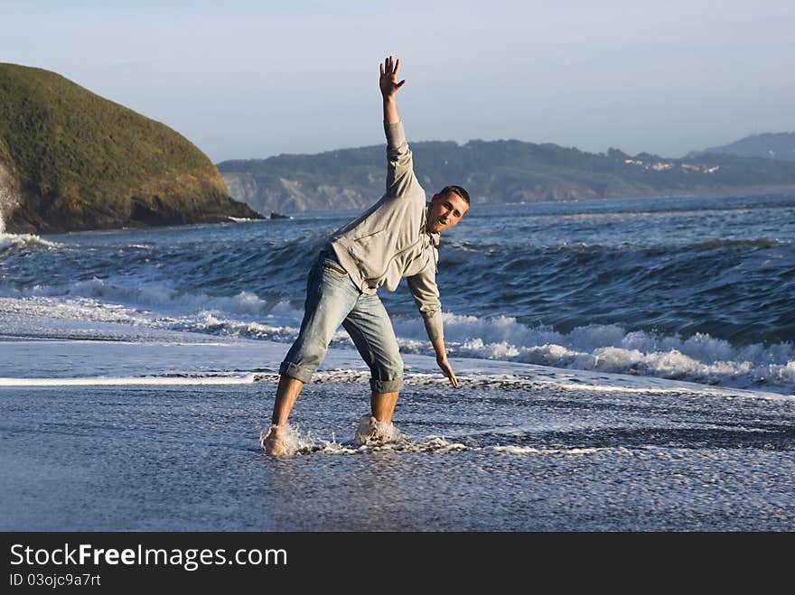 Young having fun at the shoreline at first time. Young having fun at the shoreline at first time