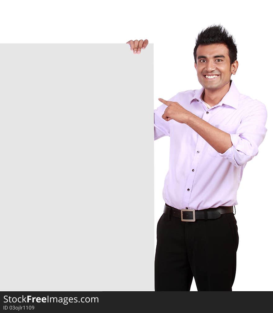 Handsome Businessman holding a blank sign in front of him