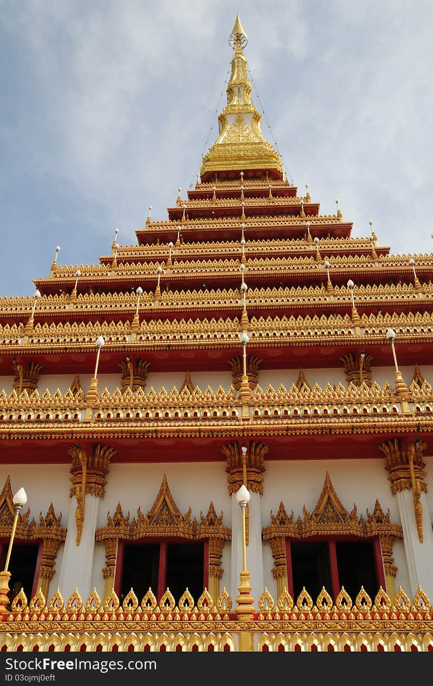 Details of traditional Thai art on base of church.