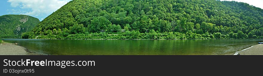 A panoramic of mountains surrounding the Delaware River. A panoramic of mountains surrounding the Delaware River.