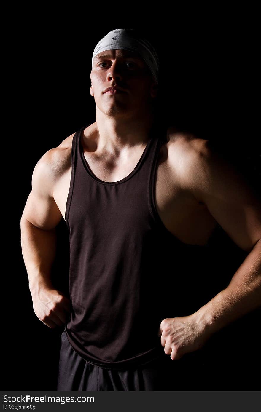 Pumped white guy posing on black background. Pumped white guy posing on black background