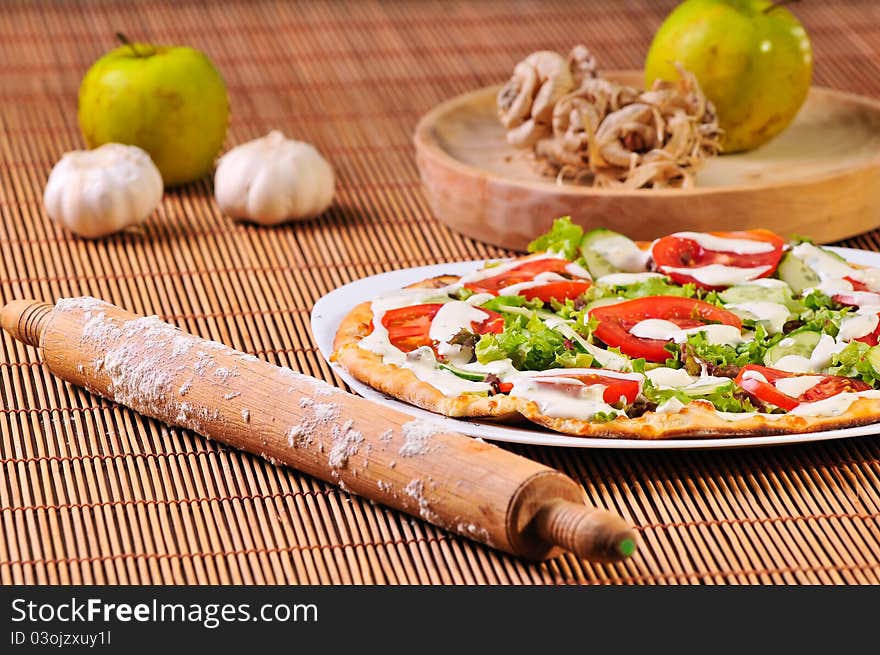 Italian pizza slice on table with red juice