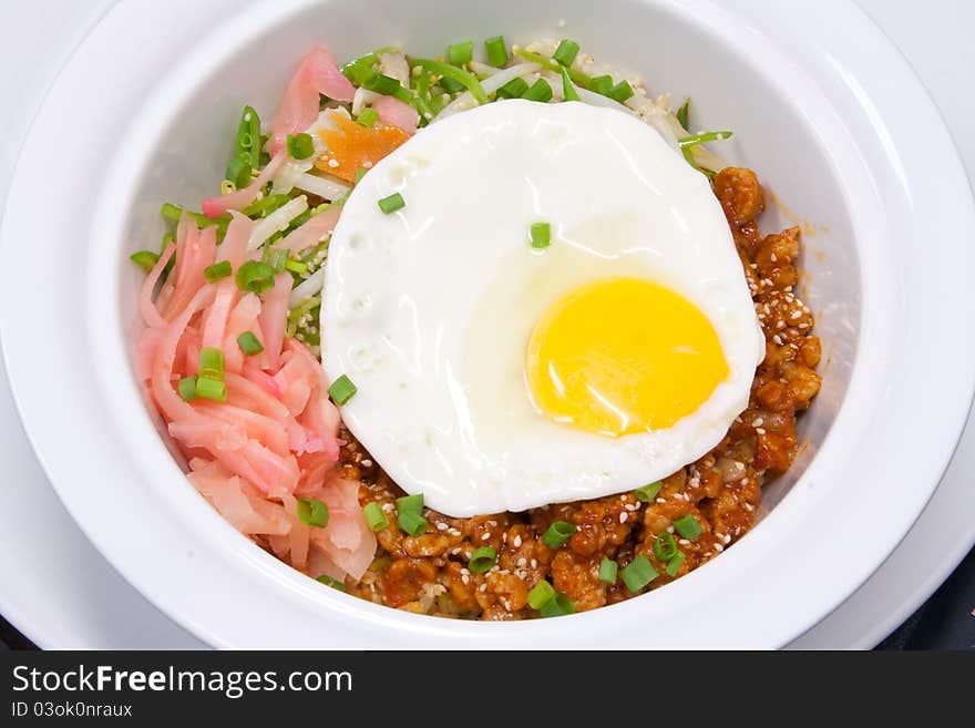 Traditional South Korean food called bibimbap spicy vegetables mix with egg