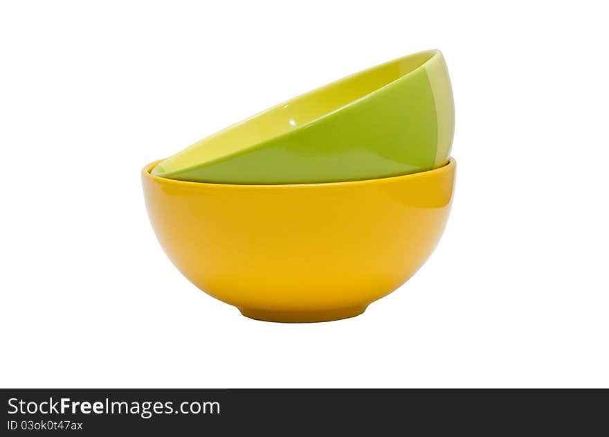 Green and yellow bowls isolated on white background