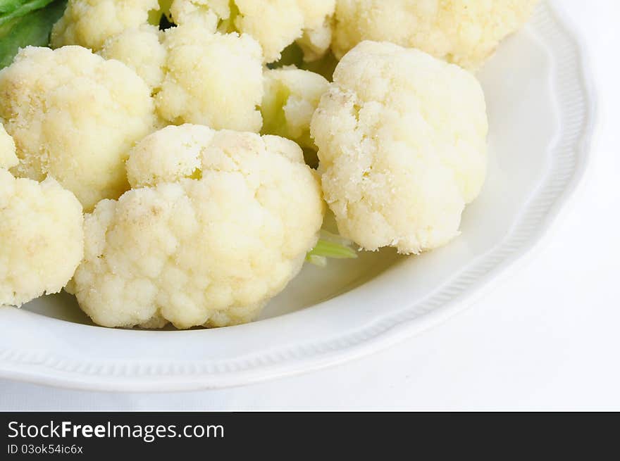 Cauliflower boil on dish ready to eat on white bac