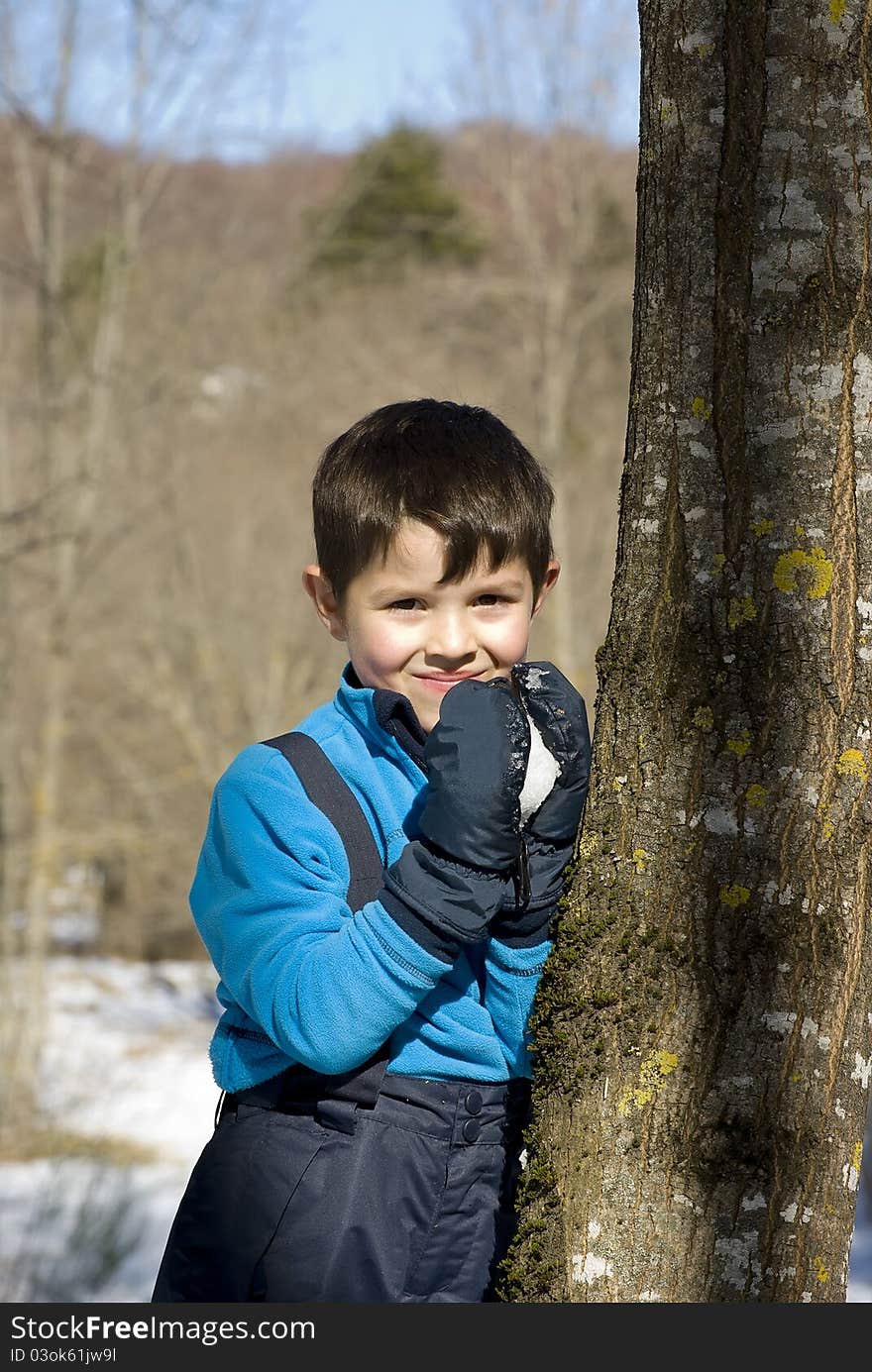 A lovely child posing on the snow. A lovely child posing on the snow