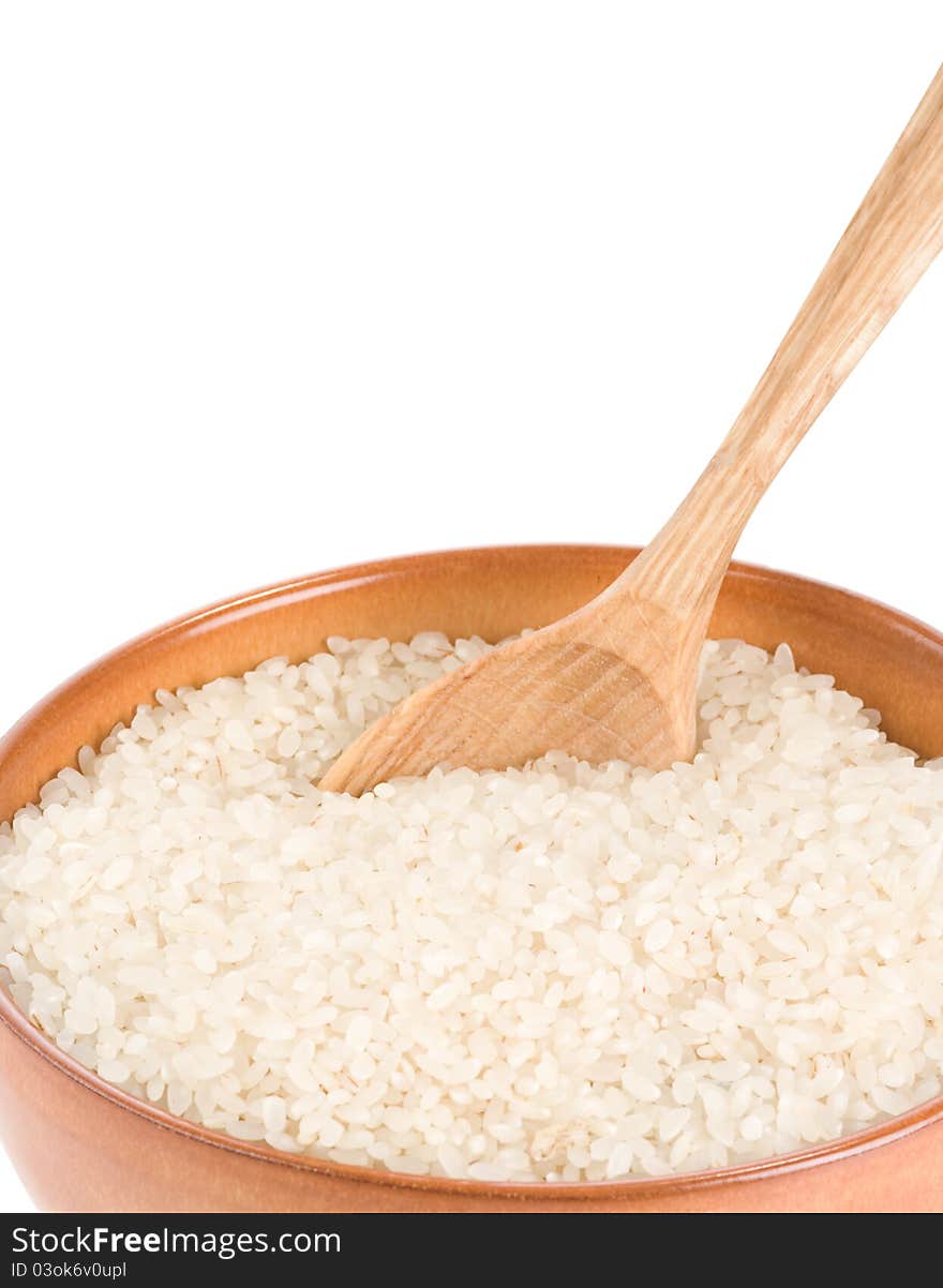 Rice in wooden plate and spoon