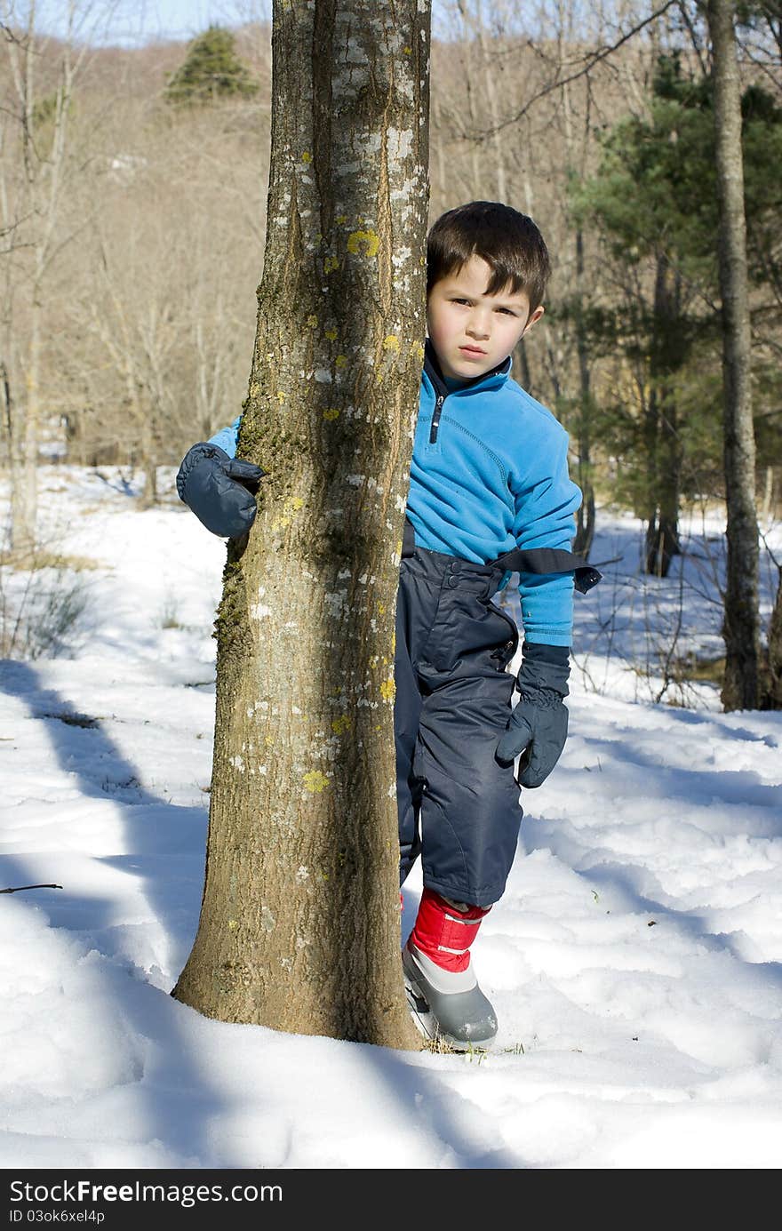 A lovely child posing on the snow. A lovely child posing on the snow