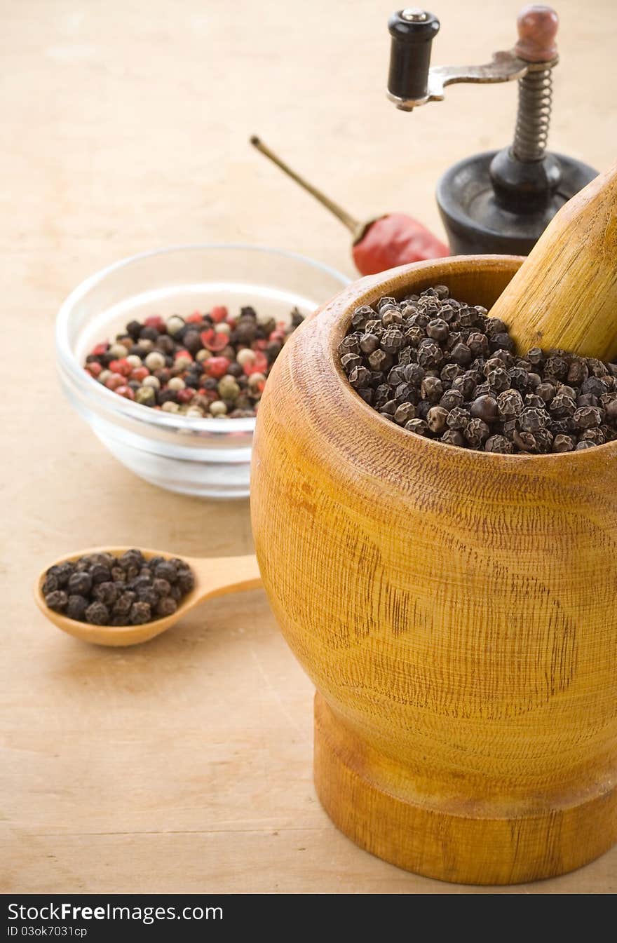 Spices and mortar on wood