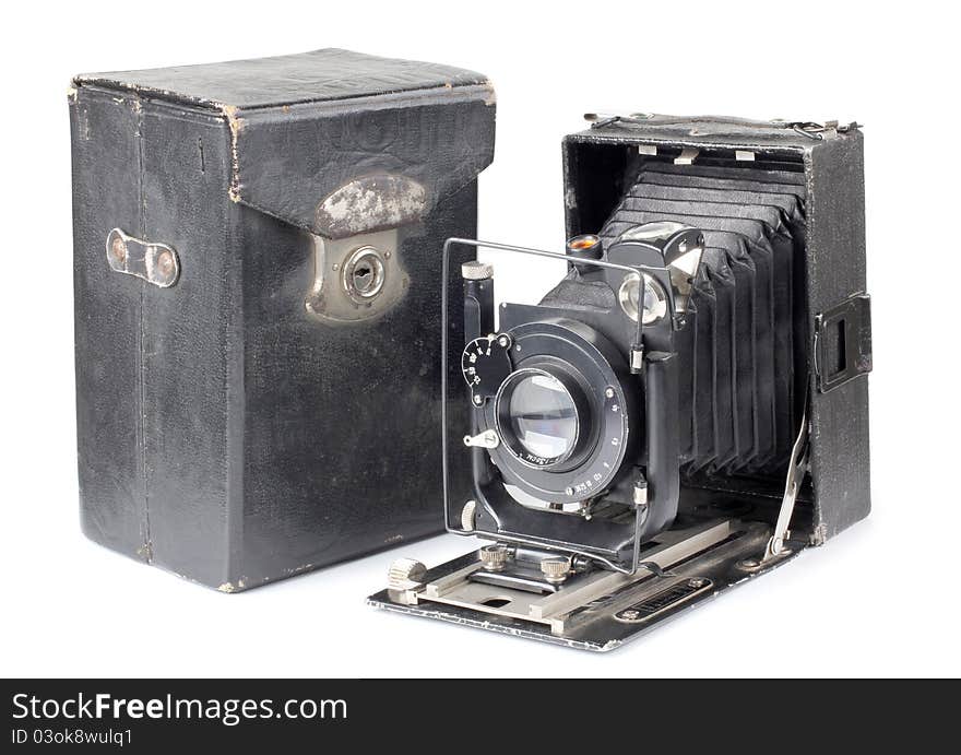 Color photo of an old camera and a cover. Color photo of an old camera and a cover