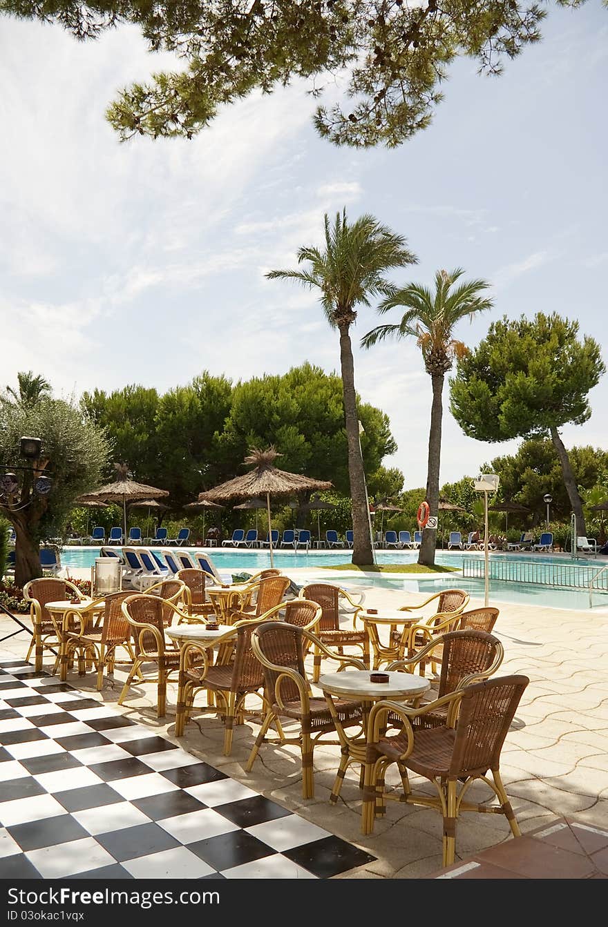 Outdoors of an hotel ( swimming pool and restaurant view ). Outdoors of an hotel ( swimming pool and restaurant view )