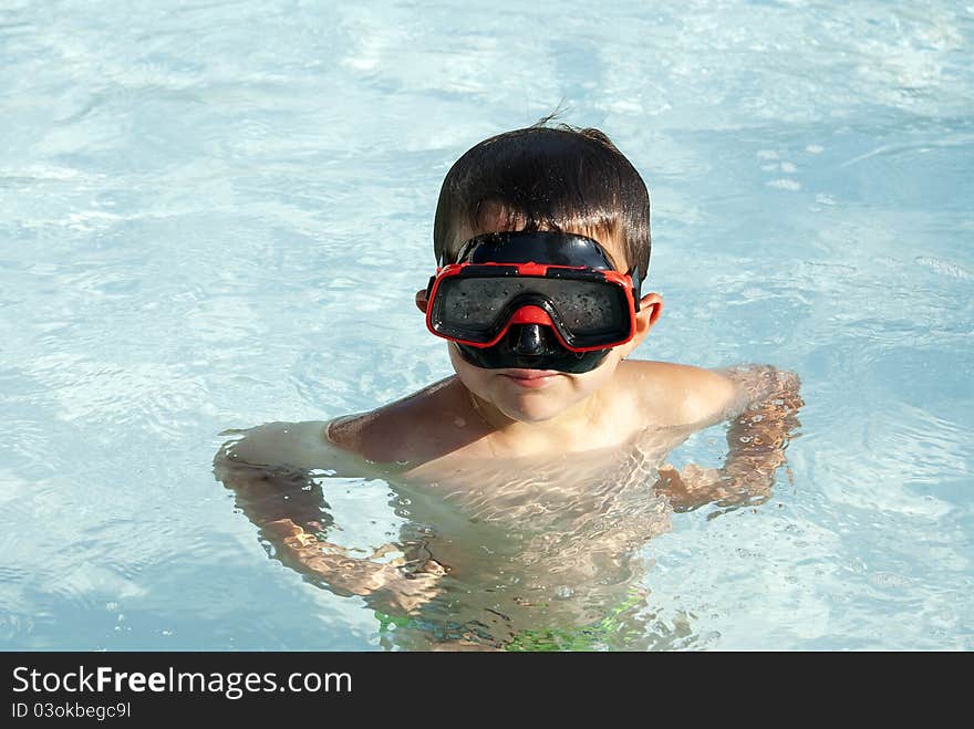 A Lovely child into the swimming pool. A Lovely child into the swimming pool