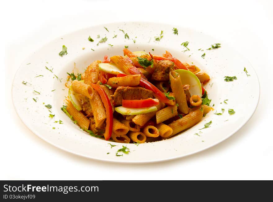 Plate of pasta with vegetables and herbs