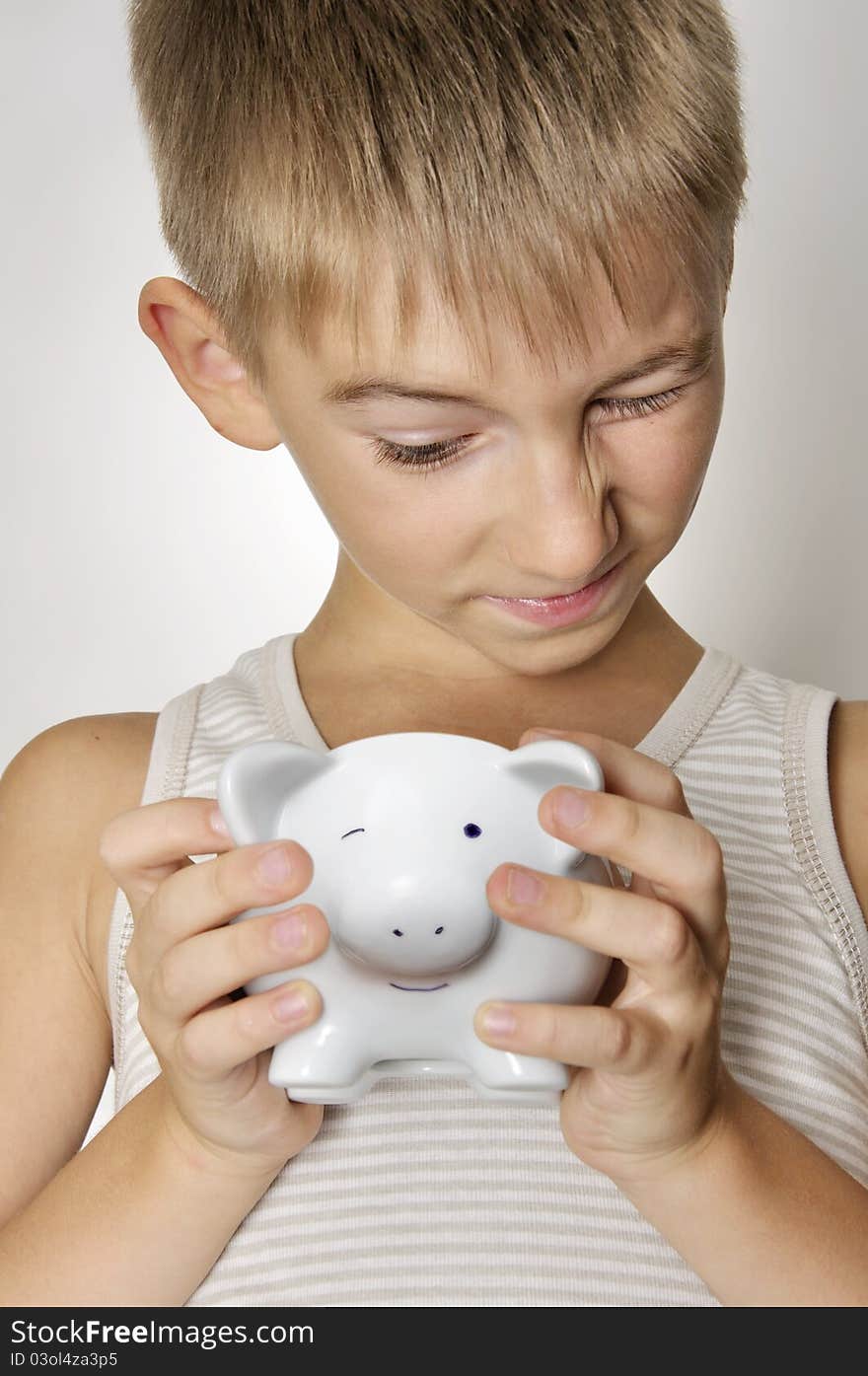 Boy with piggy bank