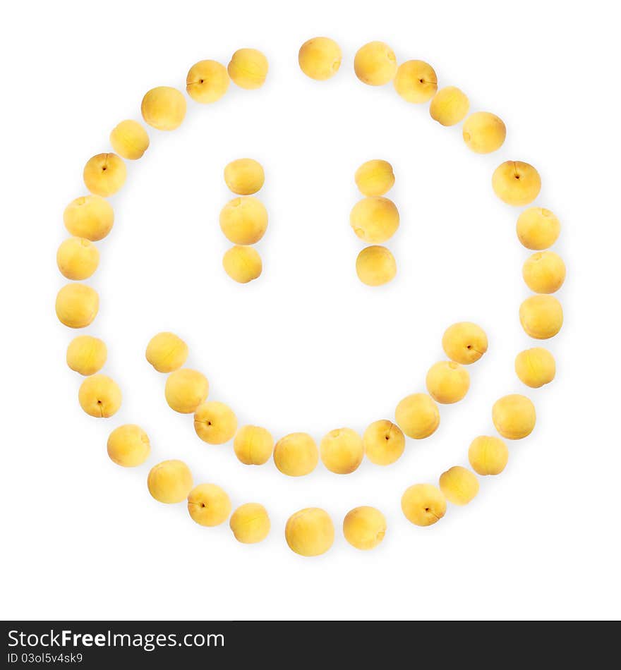 Smile made of apricots with shadow. Isolated on a white background