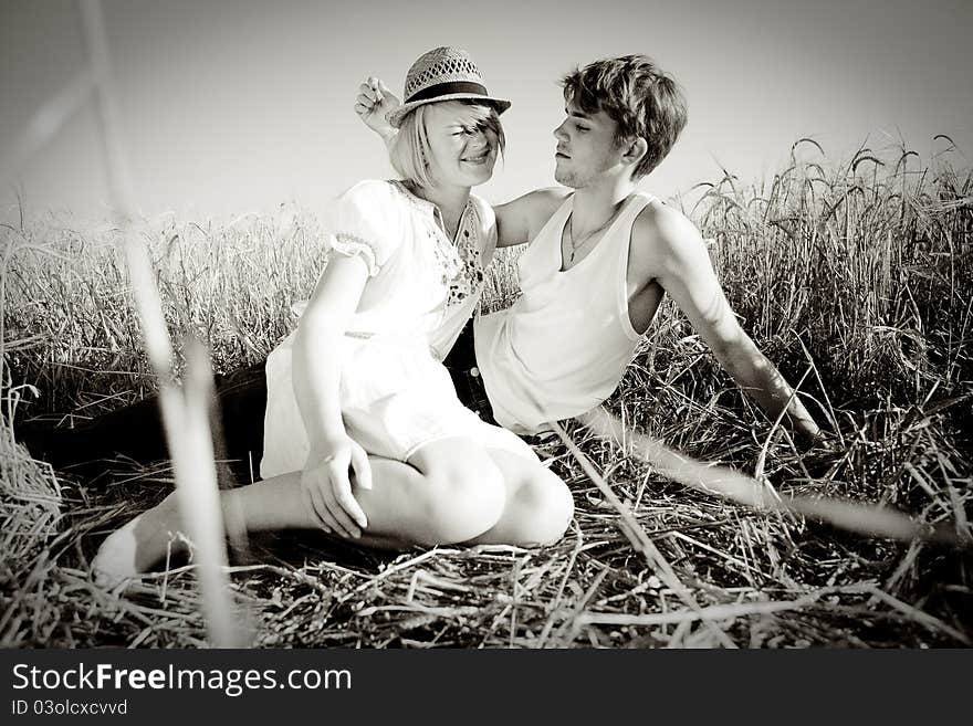 Image Of Young Man And Woman On Wheat Field