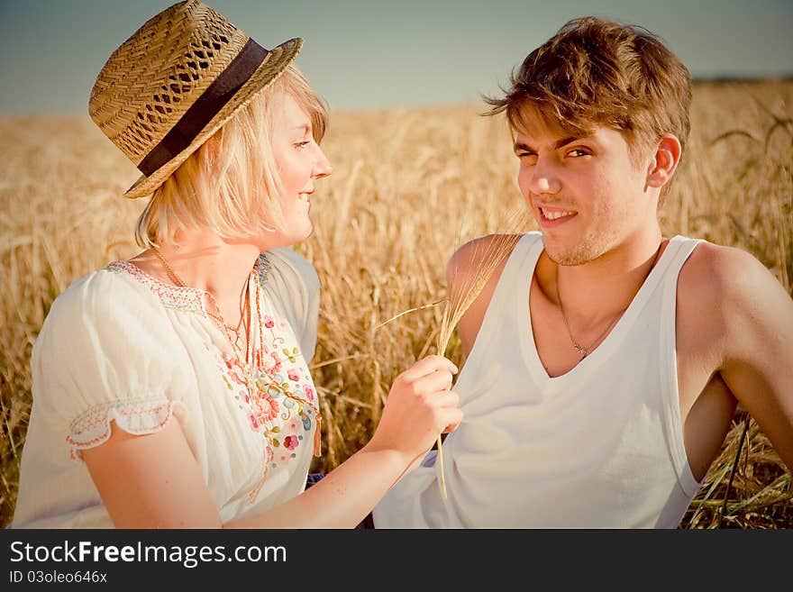 Image of young man and woman on wheat field