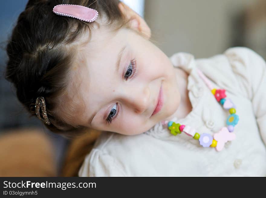 A tender indoors portrait of blue-eyed toddler. A tender indoors portrait of blue-eyed toddler