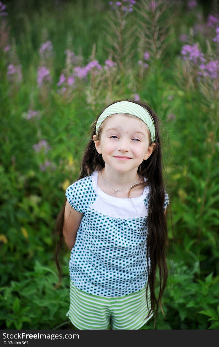 Outdoors portrait of adorable amazed blue-eyed child girl. Outdoors portrait of adorable amazed blue-eyed child girl